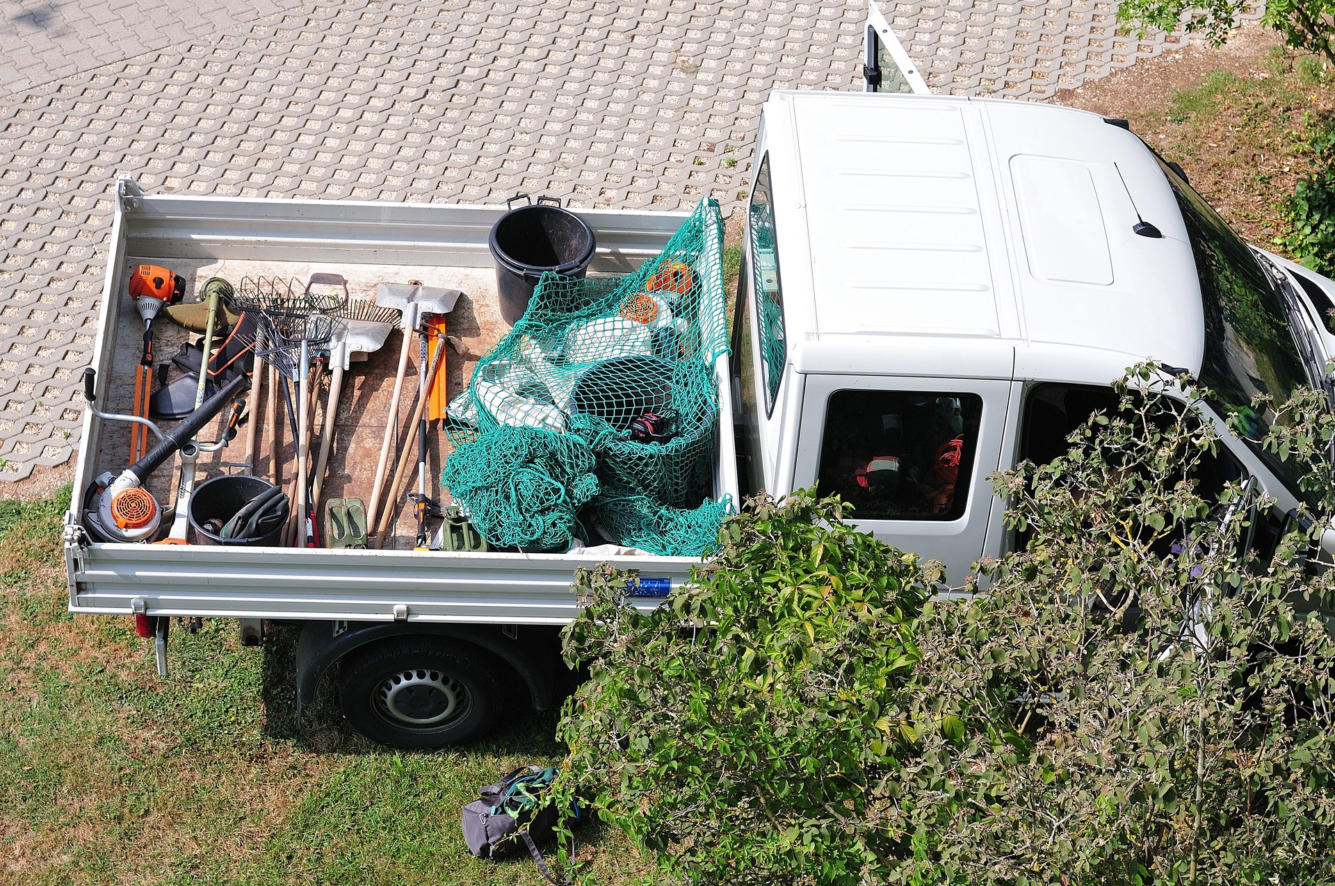 gardening tools on back of a pickup